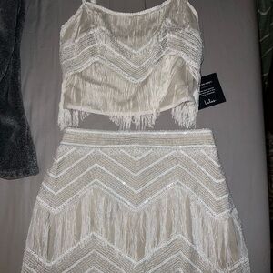 Lulus 2 piece skirt and top. Fringe with stitched sequins